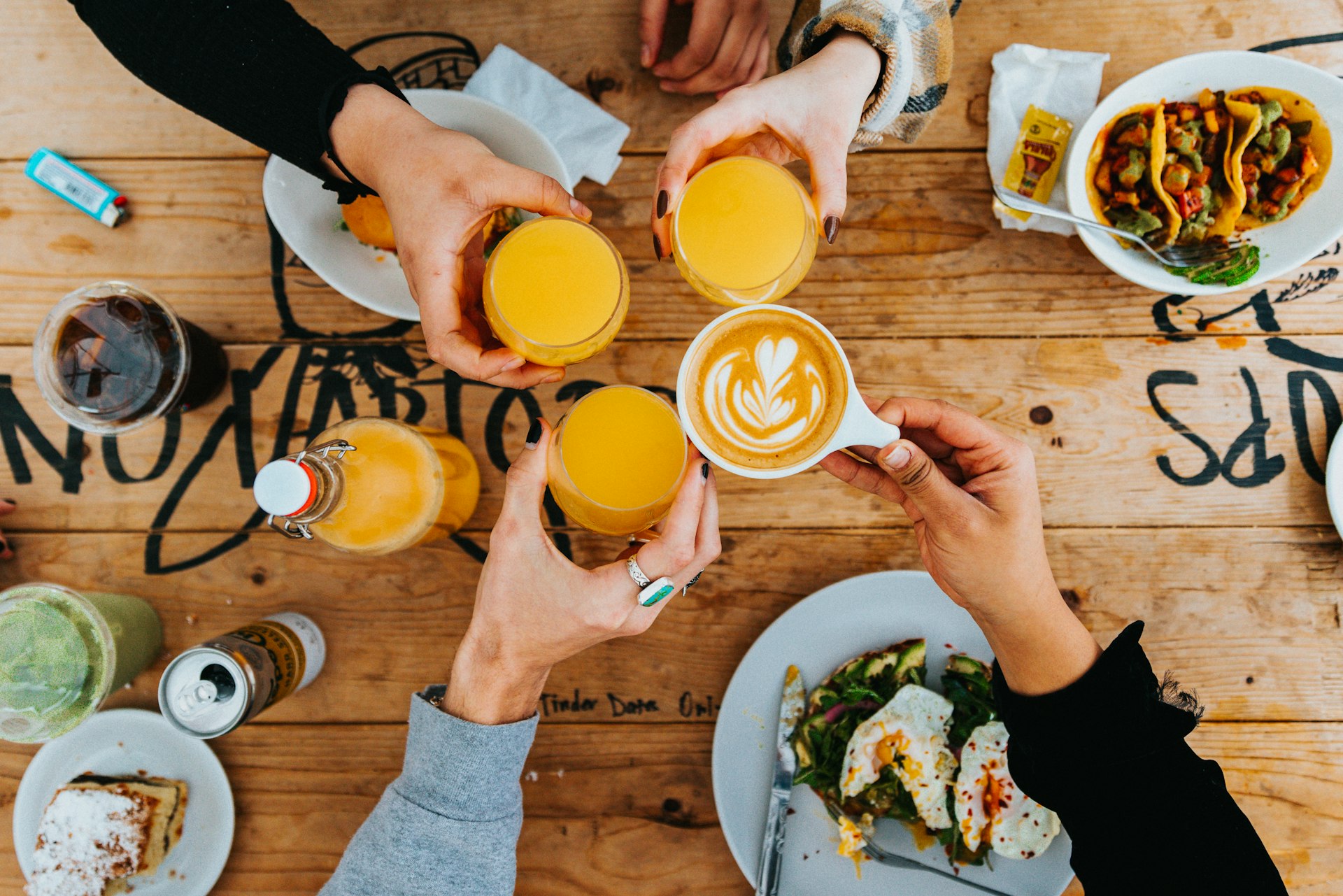 a group of people sitting at a table with drinks