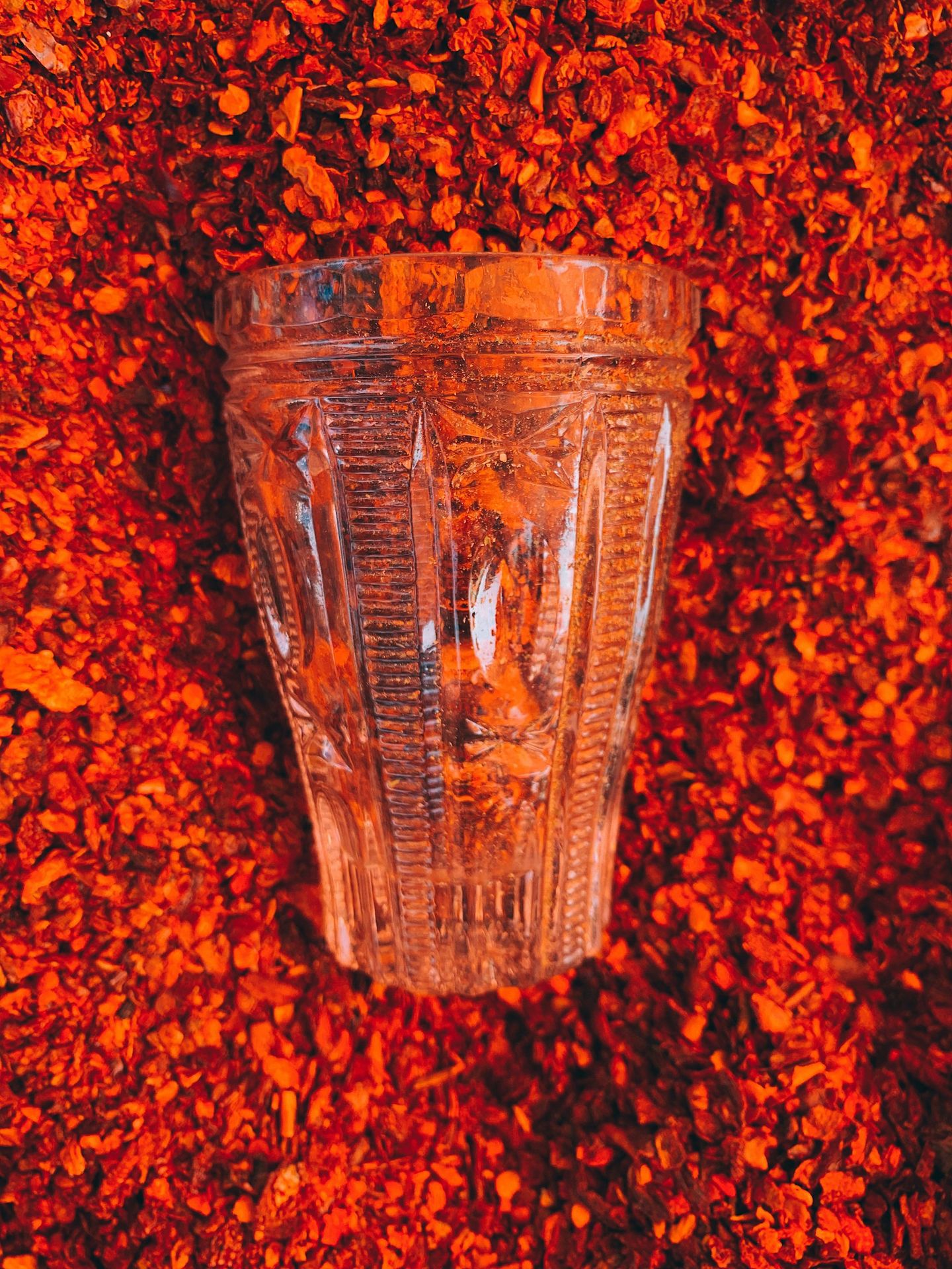 clear drinking glass on brown textile